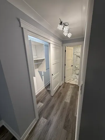 wooden floor in an empty room with a mirror