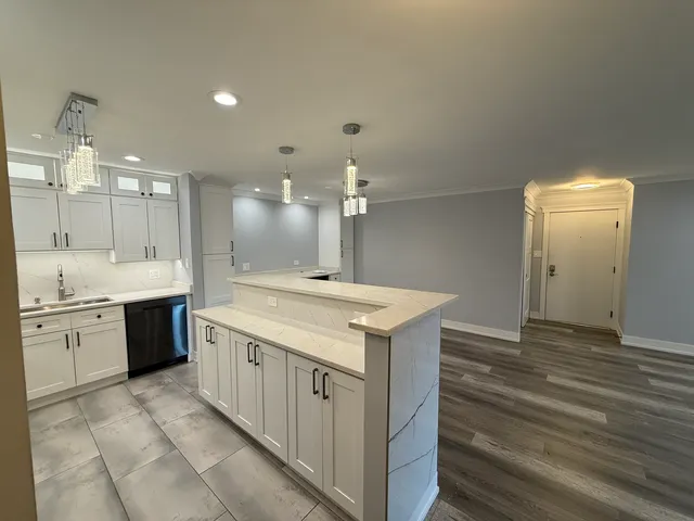 a kitchen with a sink stove and refrigerator
