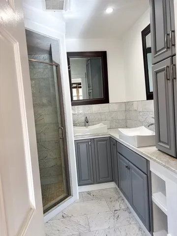 a bathroom with a sink and a mirror