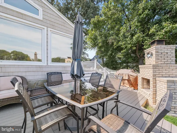a view of a patio with table and chairs and potted plants
