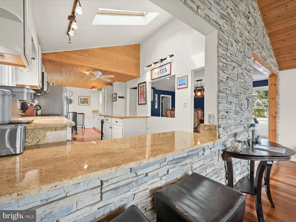 a view of a living room and kitchen