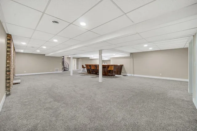 a view of a room with air conditioner duct and materials on floor