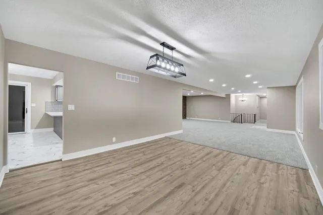 a view of livingroom with hardwood floor and hallway