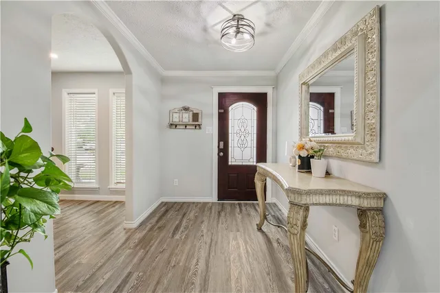 a view of living room with furniture and a potted plant