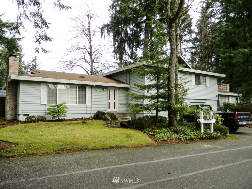 8327-8375 Phillips Road Southwest Lakewood, WA 98498 - Photo 4 of 23 a front view of a house with a yard