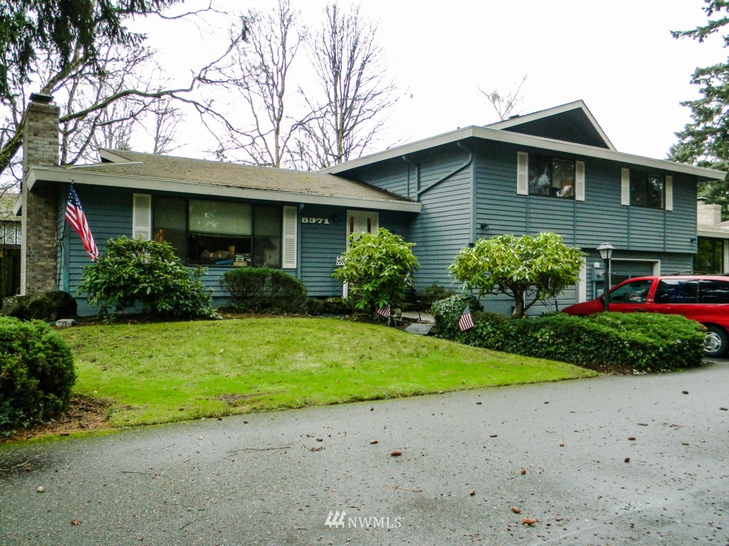 8327-8375 Phillips Road Southwest Lakewood, WA 98498 - Photo 8 of 23 a front view of a house with garden