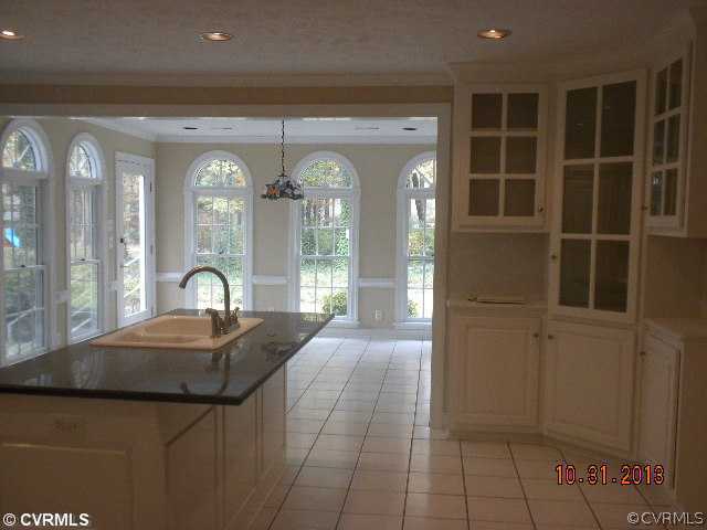 13750 Elmstead Road Midlothian, VA 23113 - Photo 2 of 9 a room with a large window and chandelier