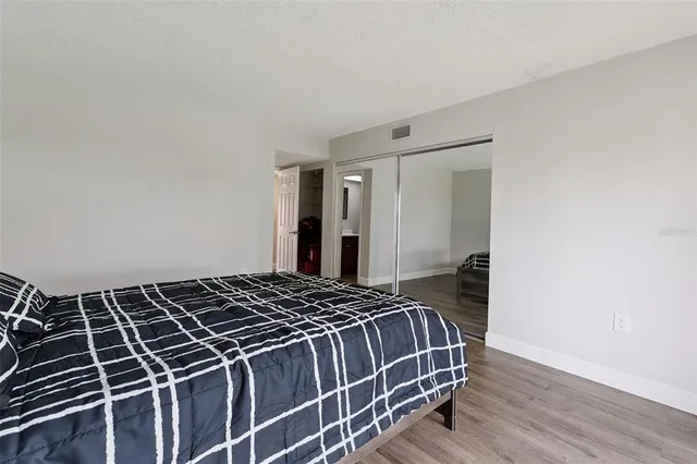 a bathroom with a toilet sink vanity and mirror