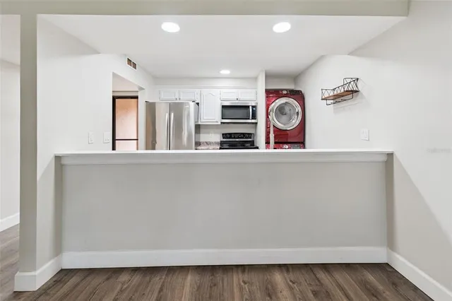 a sink with granite countertop a sink and cabinets