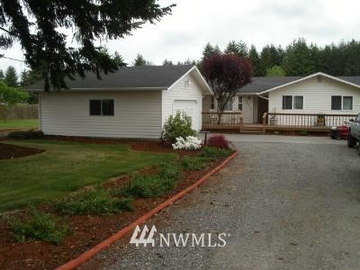 19220 Loganberry Street Southwest Rochester, WA 98579 - Photo 1 of 1 a front view of a house with a yard