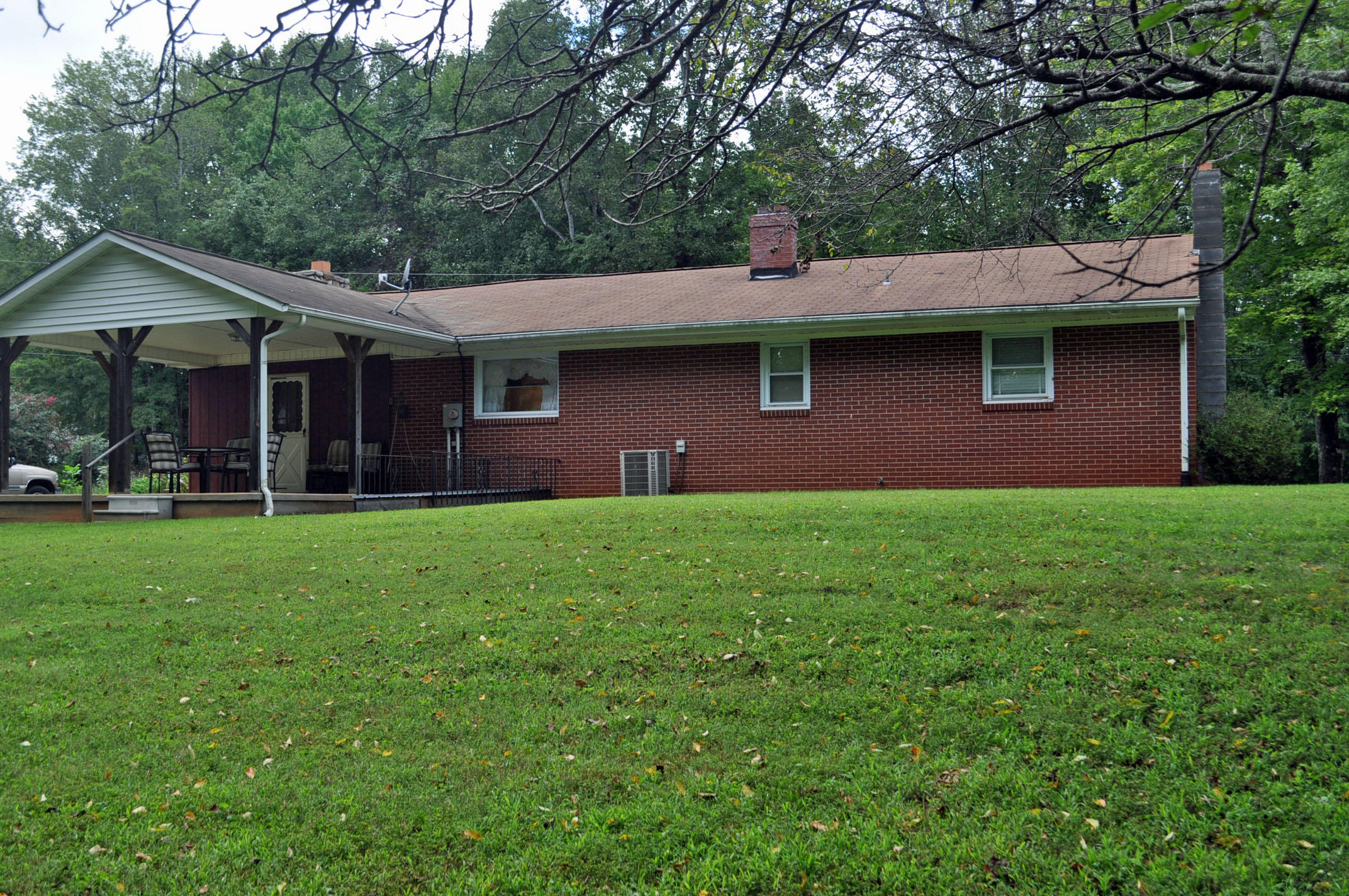 124 Pony Ridge Road Bassett, VA 24055 - Photo 14 of 41 a house view with a garden space