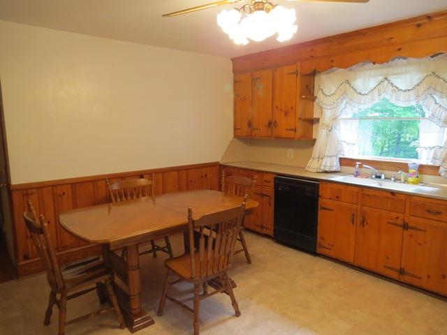 124 Pony Ridge Road Bassett, VA 24055 - Photo 22 of 41 a kitchen with a table and chairs in it