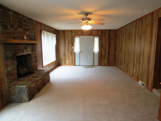 124 Pony Ridge Road Bassett, VA 24055 - Photo 26 of 41 a view of livingroom and fireplace with yard