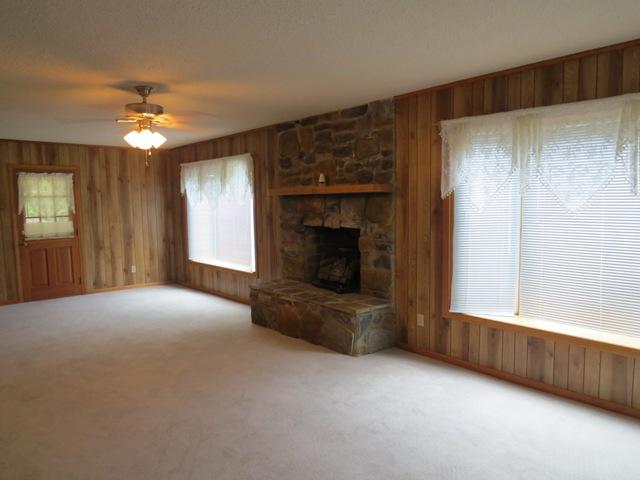 124 Pony Ridge Road Bassett, VA 24055 - Photo 27 of 41 a view of an empty room with a fireplace and a window