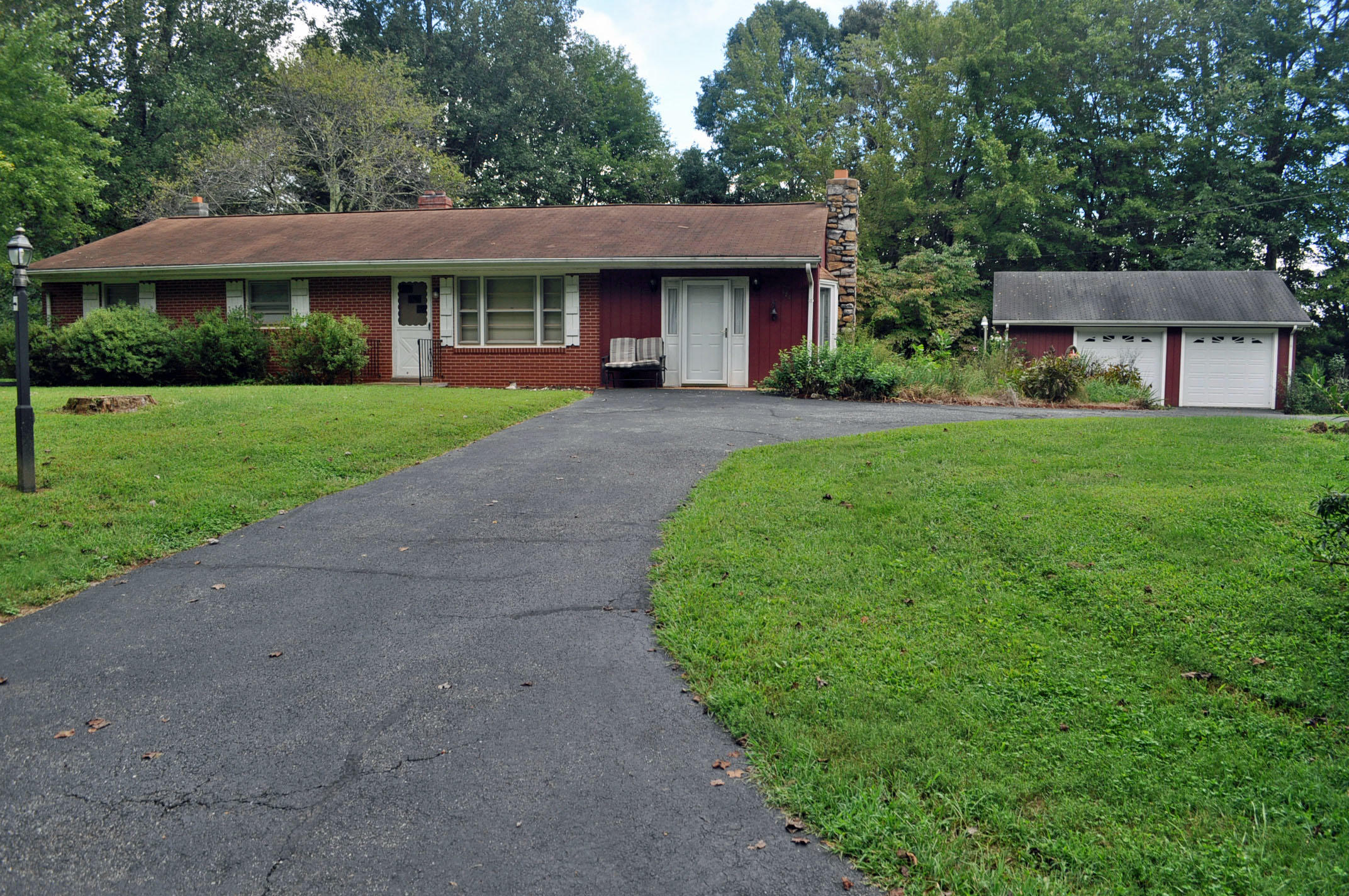 124 Pony Ridge Road Bassett, VA 24055 - Photo 4 of 41 a front view of a house with a yard