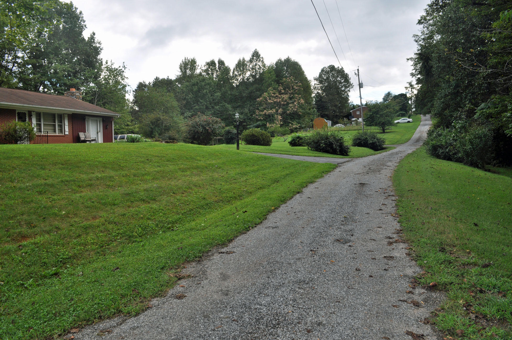 124 Pony Ridge Road Bassett, VA 24055 - Photo 6 of 41 a front view of a house with a yard