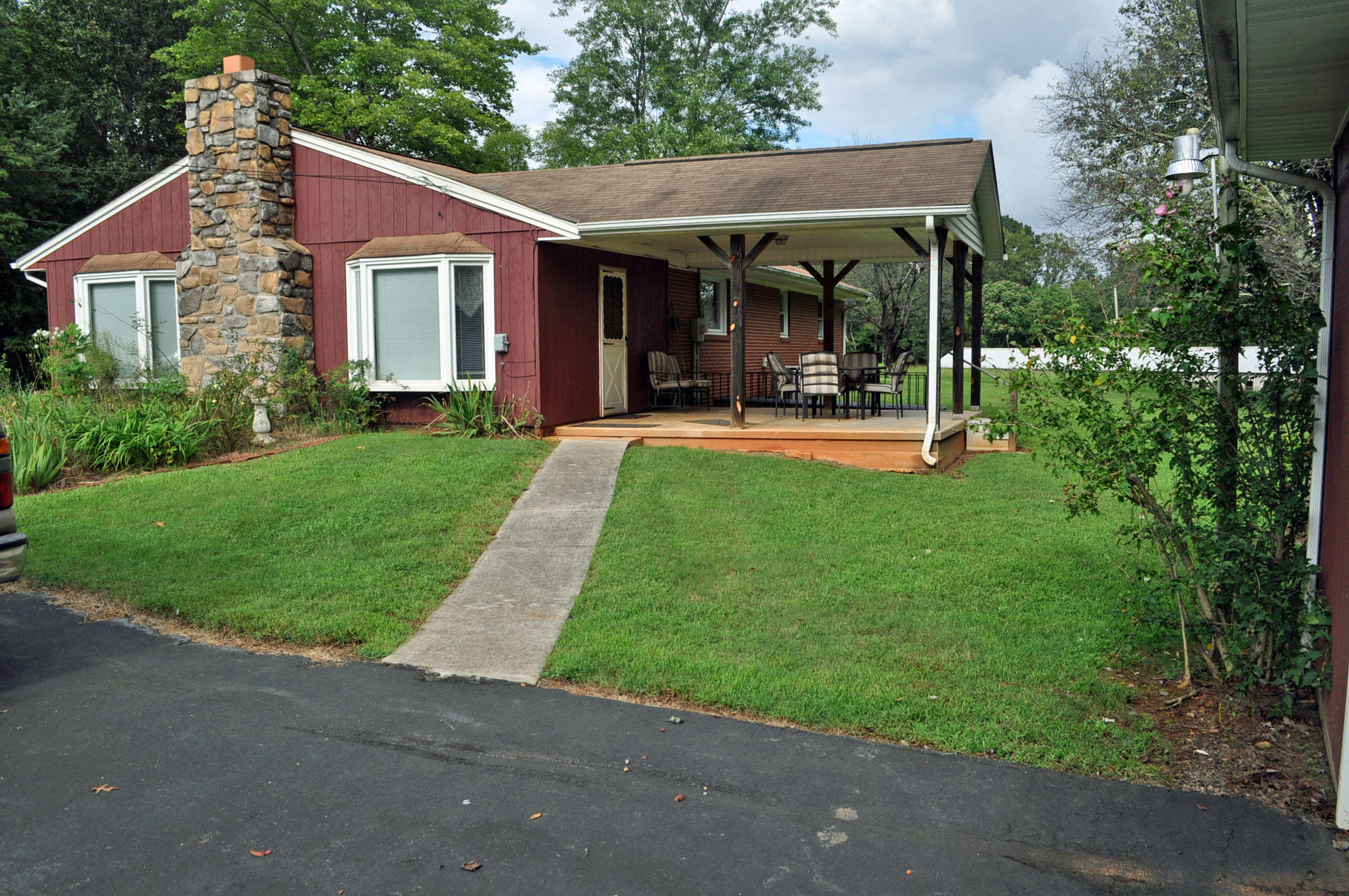 124 Pony Ridge Road Bassett, VA 24055 - Photo 10 of 41 a view of a house with porch and garden