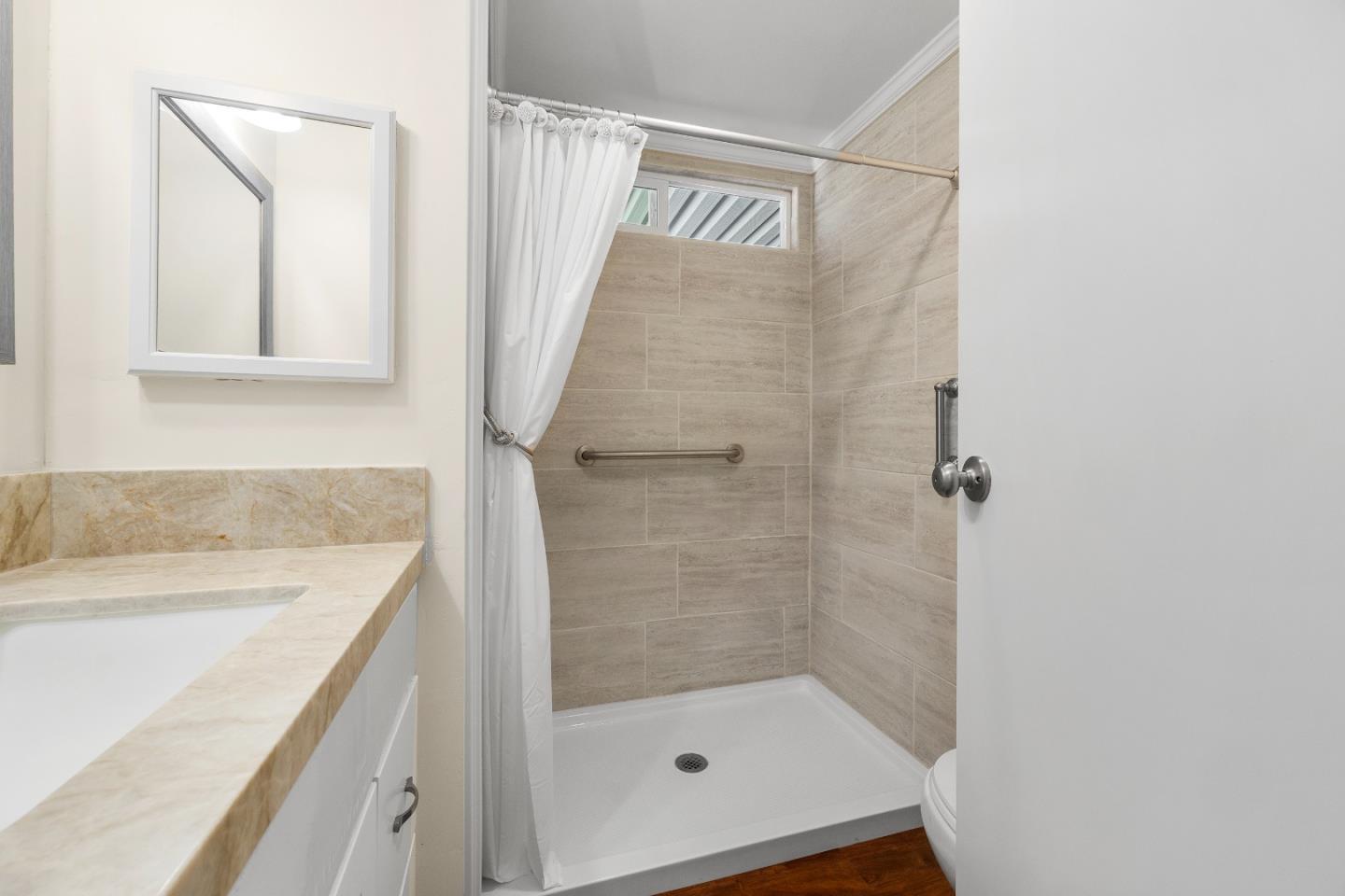 4160 Jade Street, Unit 69 Capitola, CA 95010 - Photo 16 of 27 a bathroom with a shower and a sink