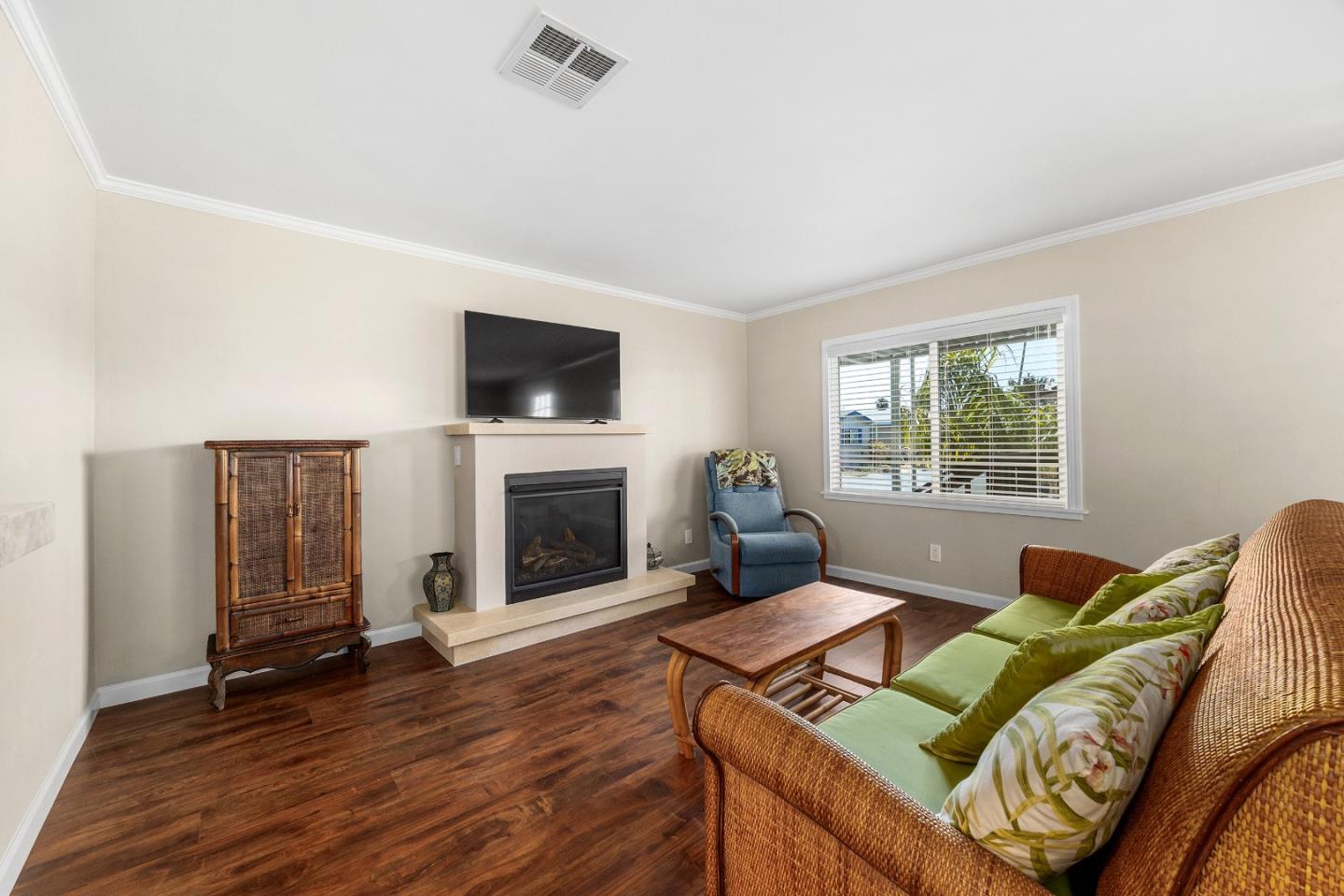 4160 Jade Street, Unit 69 Capitola, CA 95010 - Photo 5 of 27 a living room with furniture and a fireplace