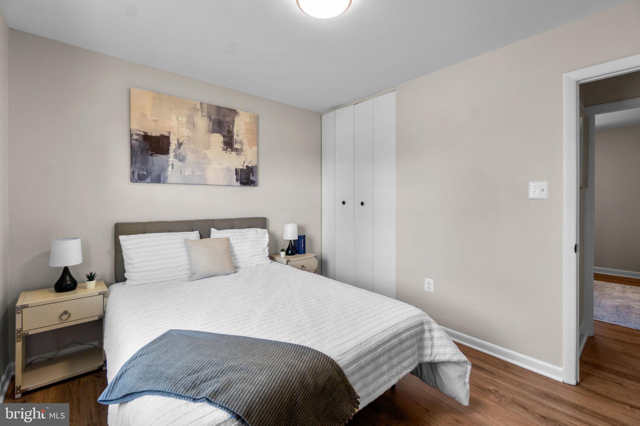 1012 Dunholme Road Reisterstown, MD 21136 - Photo 15 of 30 a bedroom with a bed and a painting on the wall