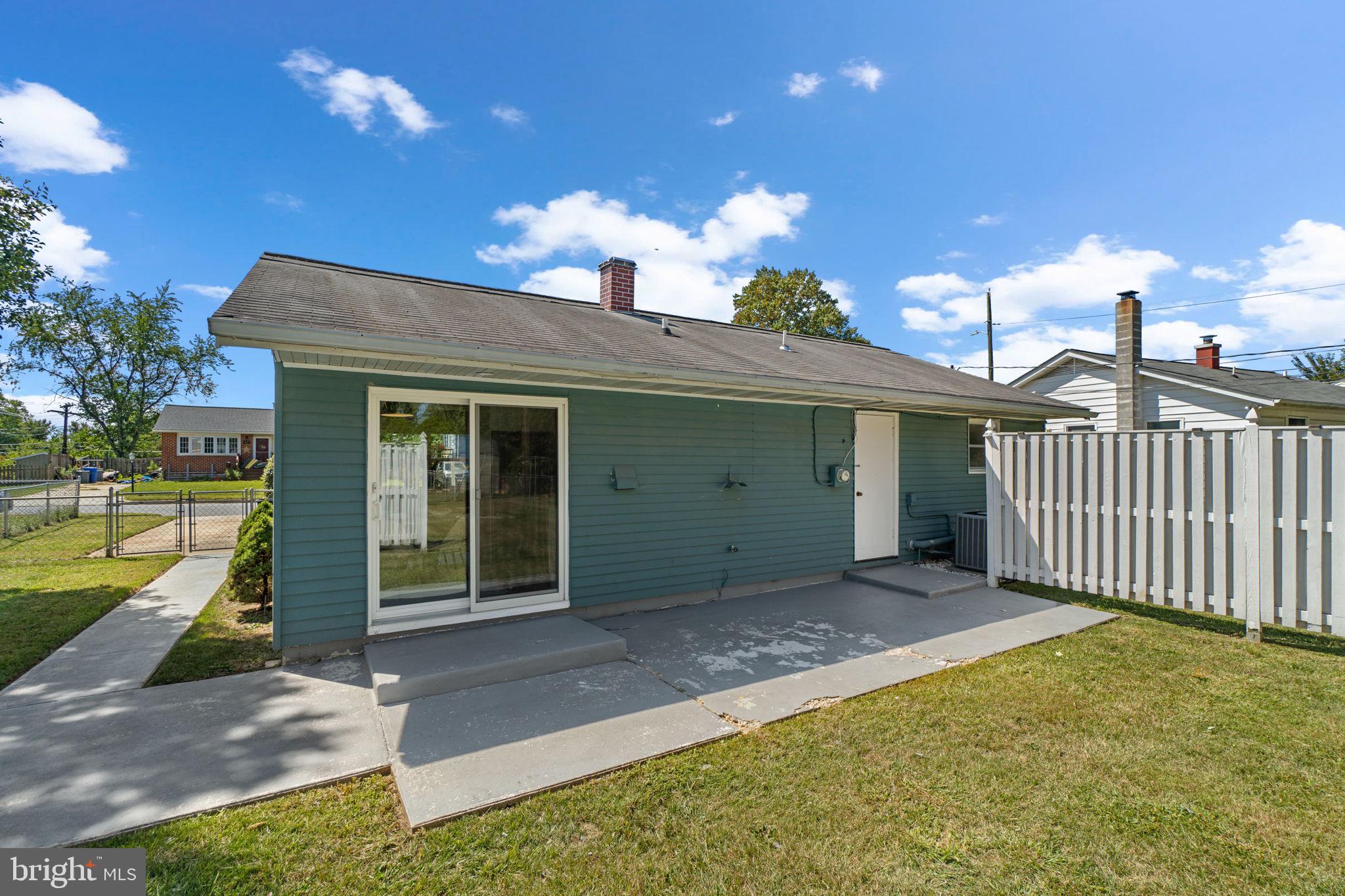 1012 Dunholme Road Reisterstown, MD 21136 - Photo 27 of 30 a view of a house with a patio and a yard