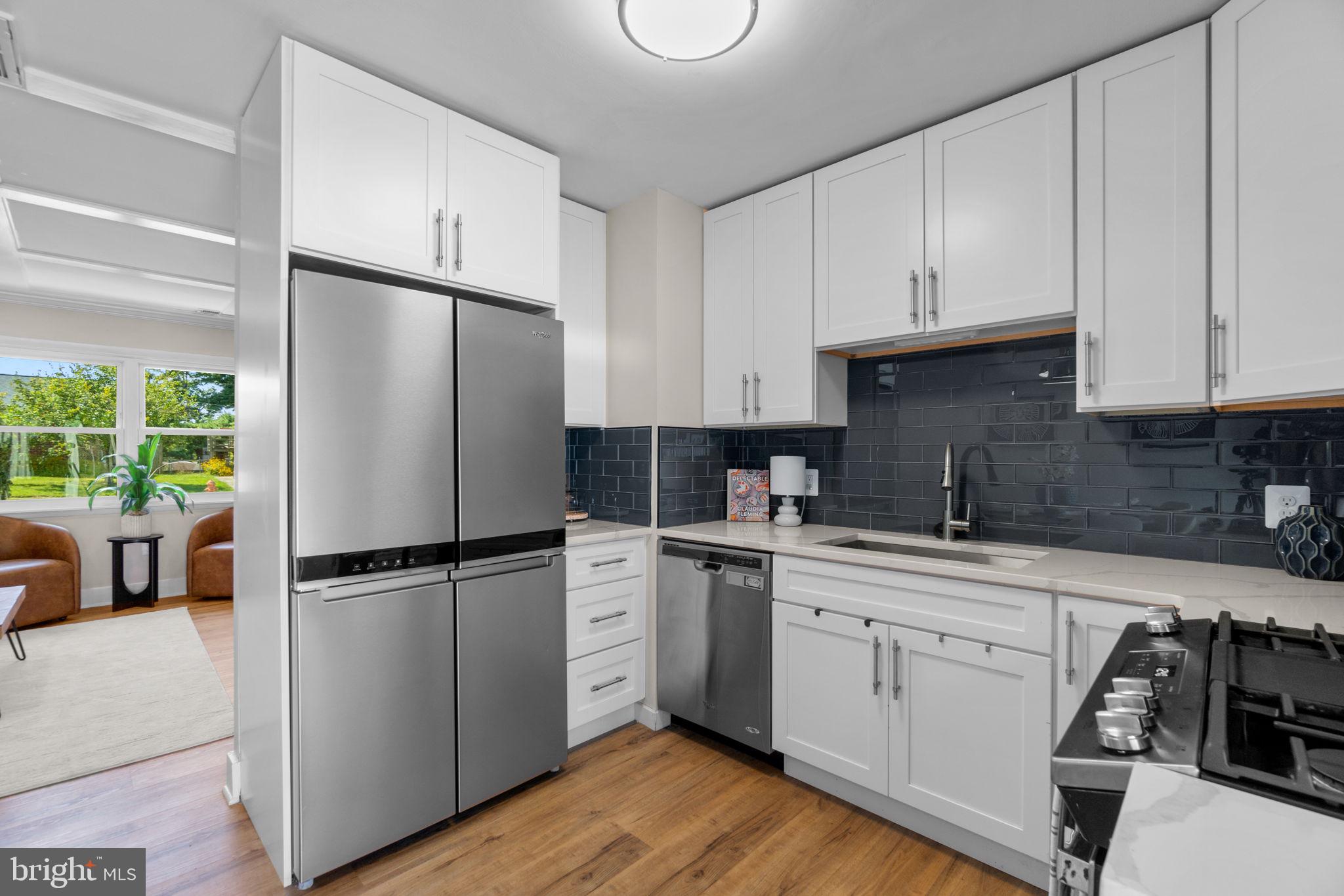 1012 Dunholme Road Reisterstown, MD 21136 - Photo 10 of 30 a kitchen with stainless steel appliances a refrigerator sink and cabinets