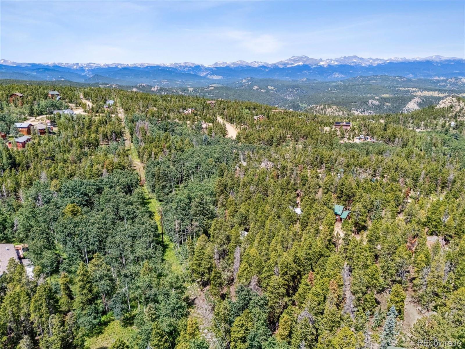 306 Olde Carter Lake Road Golden, CO 80403 - Photo 17 of 24 a view of a city with lush green forest