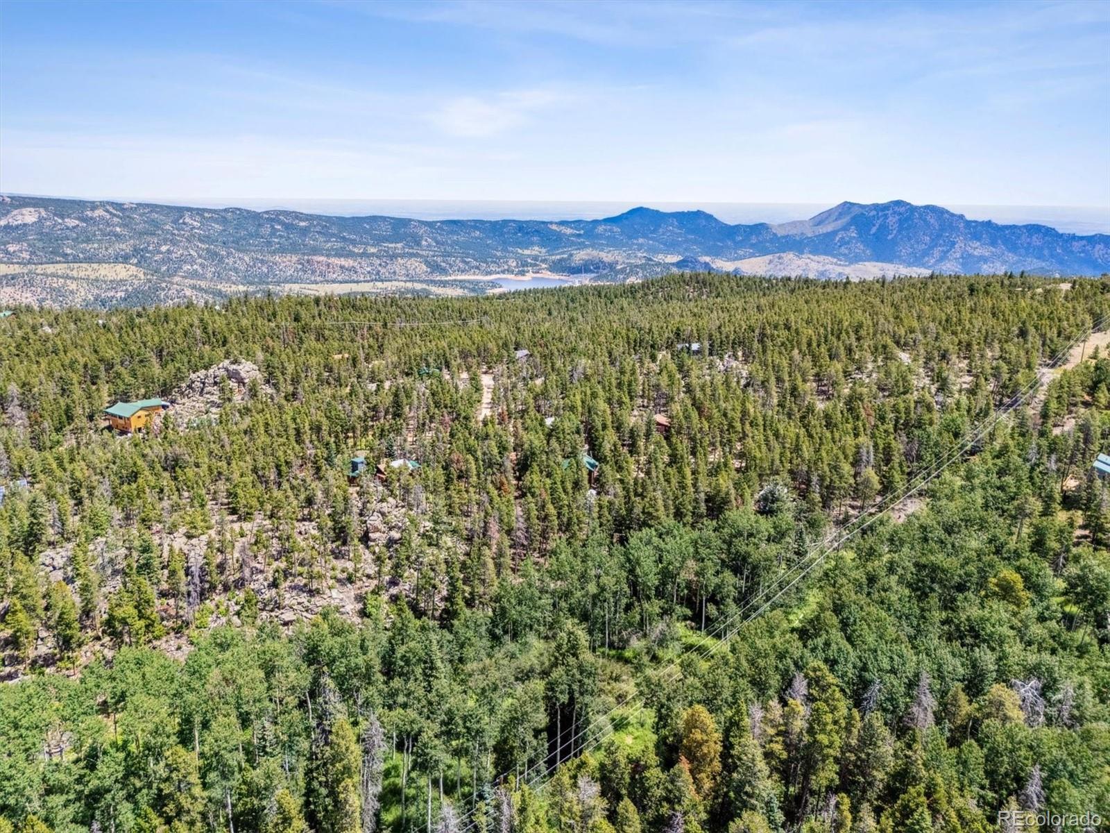 306 Olde Carter Lake Road Golden, CO 80403 - Photo 18 of 24 a view of a city with a mountain