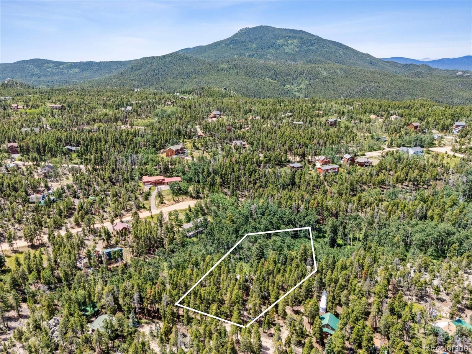 306 Olde Carter Lake Road Golden, CO 80403 - Photo 24 of 24 a view of a mountain with an outdoor space