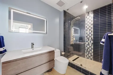 a bathroom with a toilet and shower