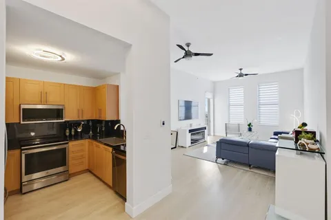 a kitchen with a refrigerator and a more cabinets