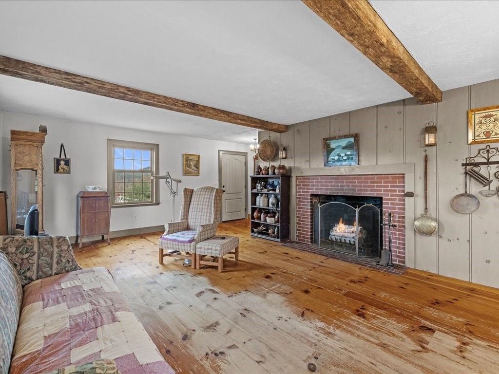 439 Lower Road Hardwick, MA 01031 - Photo 13 of 41 a living room with furniture and a fireplace