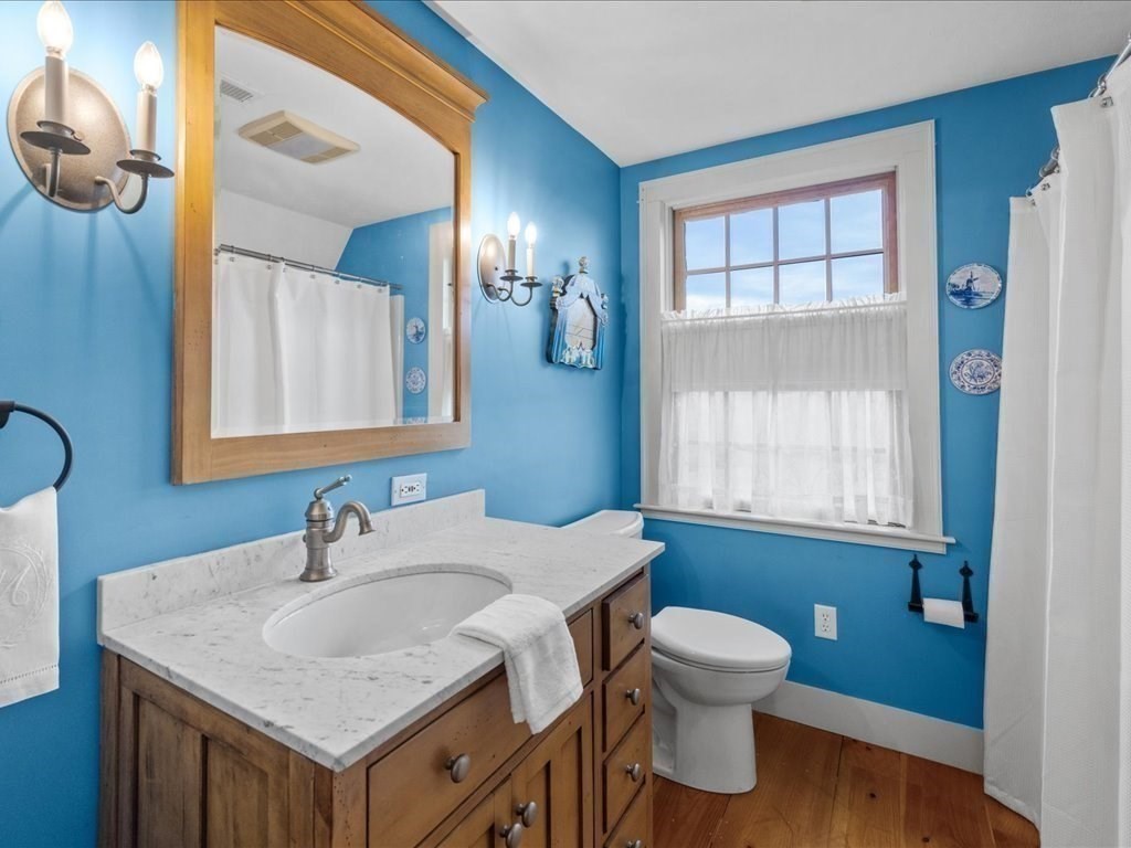 439 Lower Road Hardwick, MA 01031 - Photo 24 of 41 a bathroom with a toilet a sink and mirror