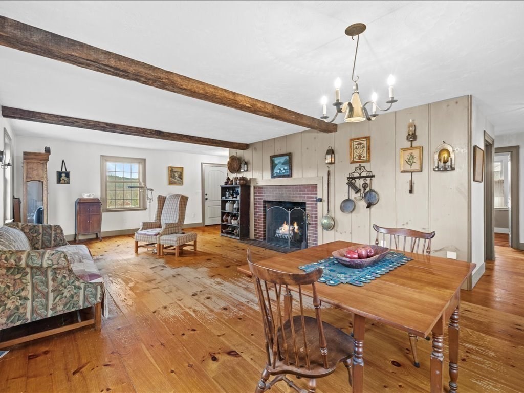 439 Lower Road Hardwick, MA 01031 - Photo 10 of 41 a living room with furniture and a fireplace