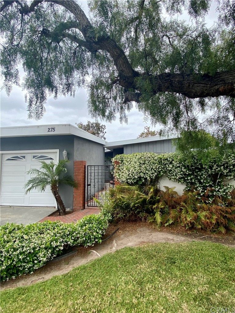 275 Cecil Place Costa Mesa, CA 92627 - Photo 1 of 1 a view of a garden with a fountain