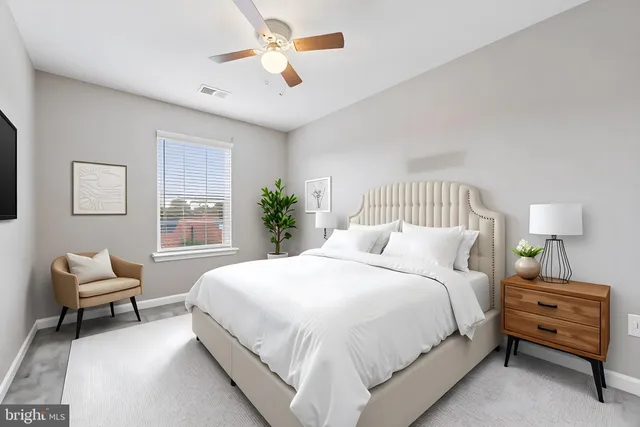 a bedroom with a bed and a couch