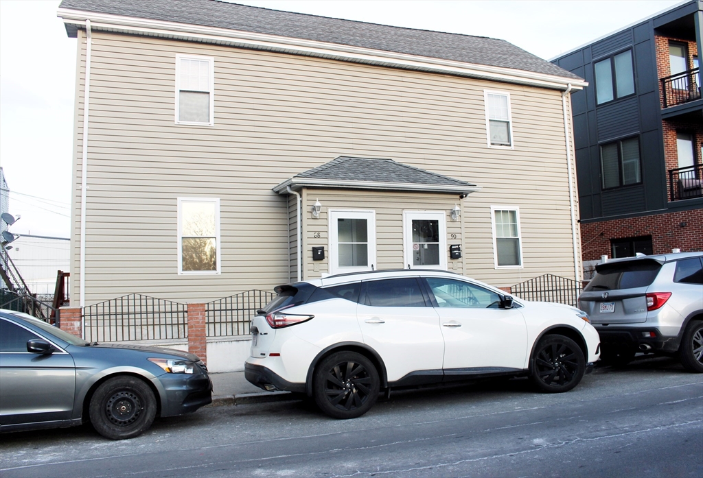 88-90 George Street Boston, MA 02119 - Photo 1 of 15 a view of a car parked in front of a house