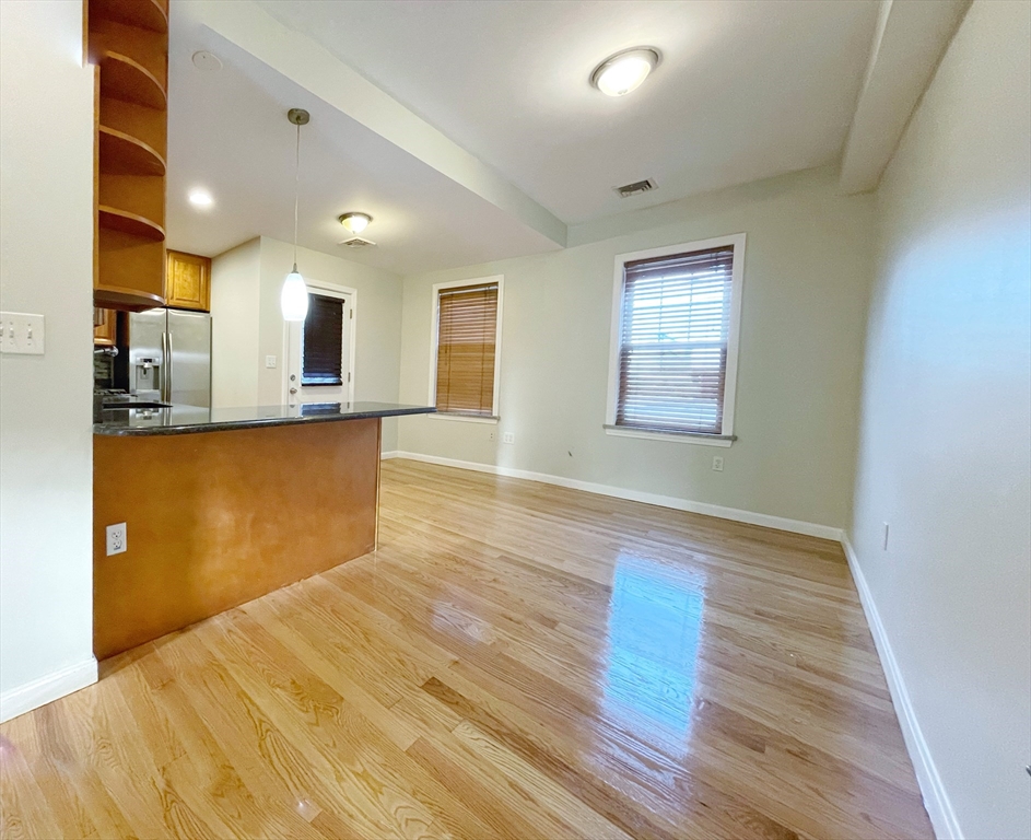 88-90 George Street Boston, MA 02119 - Photo 4 of 15 a view of a kitchen with microwave and cabinets