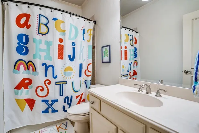 a bathroom with a sink and a white curtain
