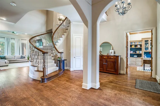a view of an entryway with wooden floor