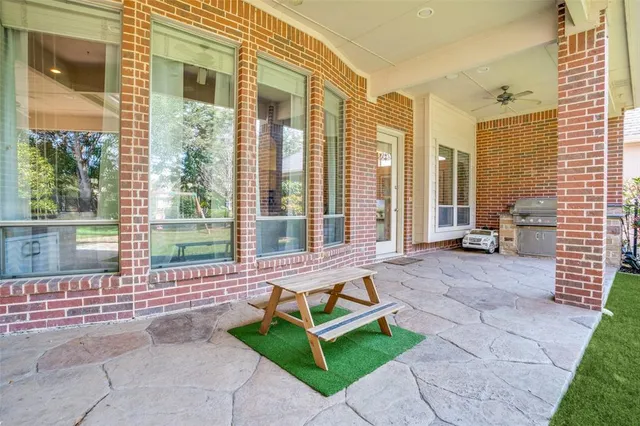a house with a garden and glass windows