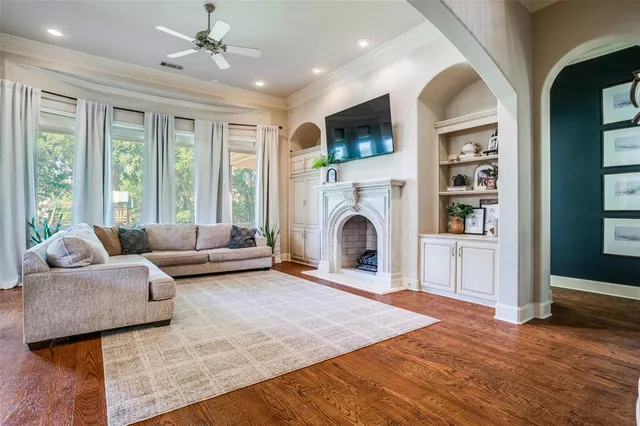 a living room with furniture and a fireplace