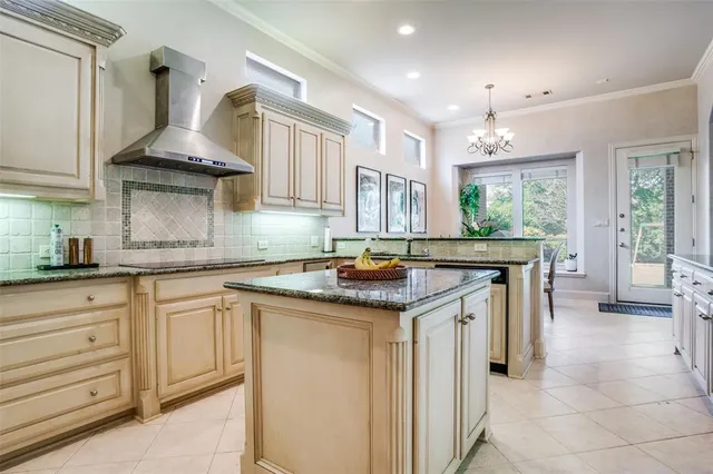 a kitchen with stainless steel appliances granite countertop a sink and cabinets