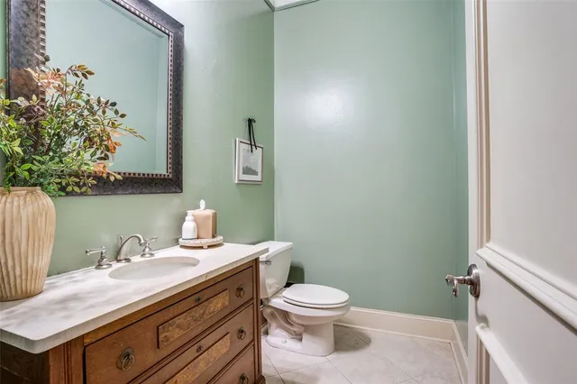 a bathroom with a sink toilet and vanity