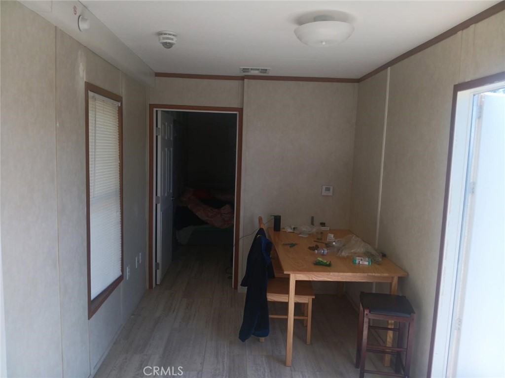 1403 Forbestown Road Oroville, CA 95966 - Photo 4 of 26 a view of a dining room with furniture and wooden floor