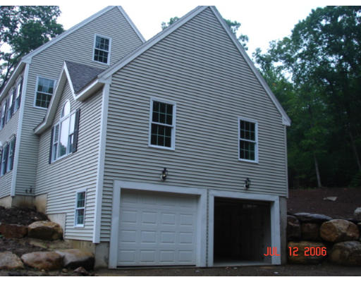 971 Lincoln Road Oakham, MA 01068 - Photo 2 of 13 a view of a house with a yard