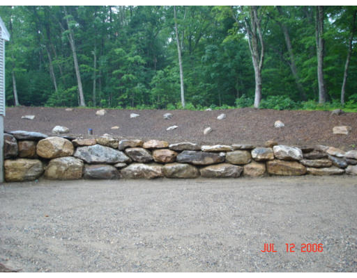 971 Lincoln Road Oakham, MA 01068 - Photo 3 of 13 a backyard of a house with lots of green space