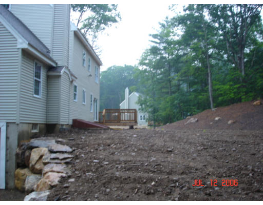 971 Lincoln Road Oakham, MA 01068 - Photo 4 of 13 a backyard of a house with lots of green space