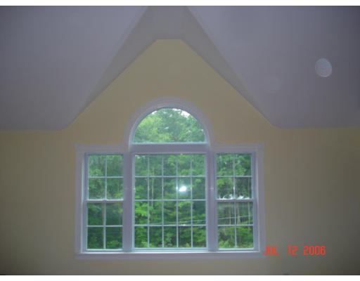971 Lincoln Road Oakham, MA 01068 - Photo 7 of 13 a front view of a house with a large window