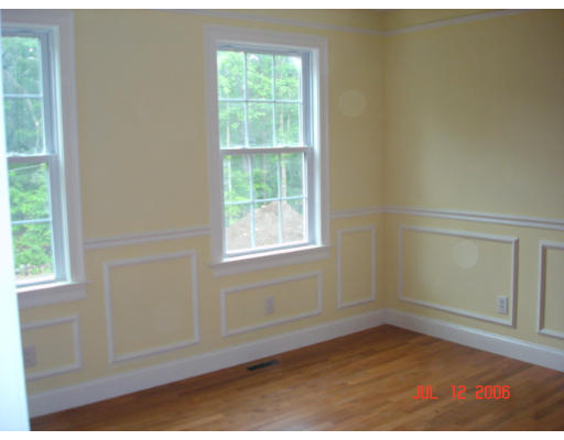 971 Lincoln Road Oakham, MA 01068 - Photo 9 of 13 an empty room with wooden floor and windows